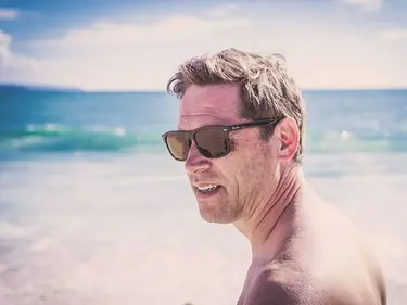 Man wearing sunglasses in the beach